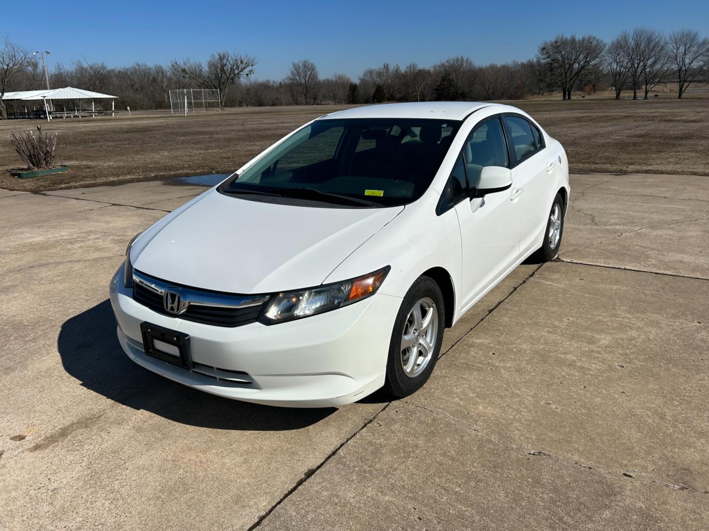 2012 White /Gray Honda Civic CNG Sedan 5-Speed AT (19XFB5F59CE) with an 1.8L L4 SOHC 16V CNG engine, 5-Speed Automatic transmission, located at 17760 Hwy 62, Morris, OK, 74445, (918) 733-4887, 35.609104, -95.877060 - Photo#0